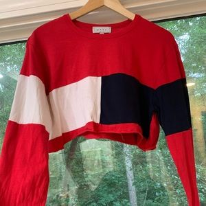 red, blue, and white long sleeve cropped tee